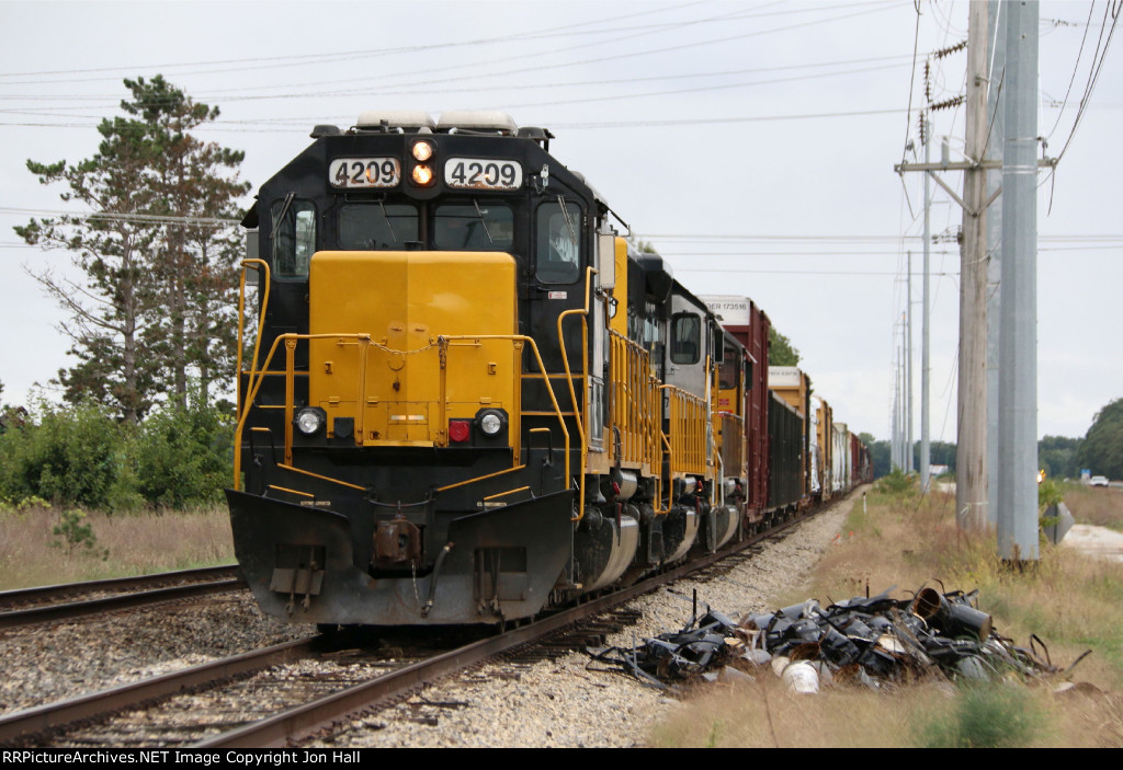 Three WAMX SD's sit with their train in the siding just north of town